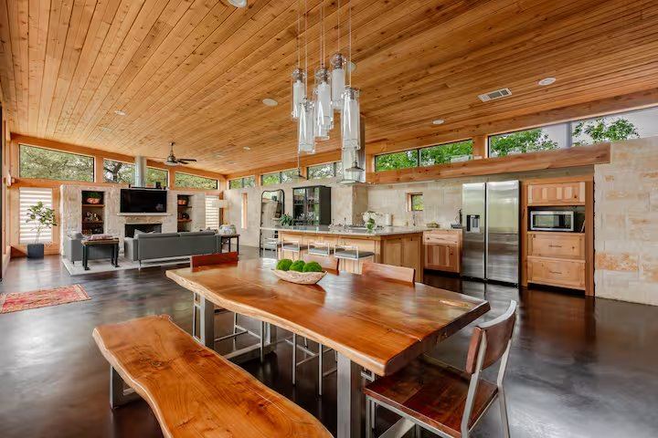 La Paz live-edge dining table with full kitchen and Hill Country views
